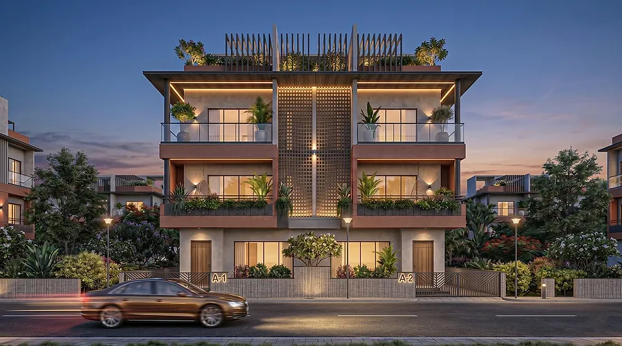 The villa facade at dusk, lit from inside, with the perforated central screen glowing between the balconies.